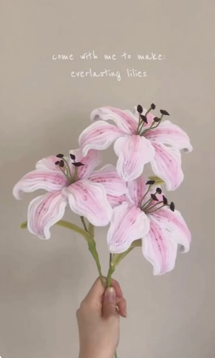 Artisan hand shaping pipe-cleaner flower